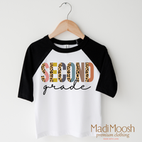 Second Grade Leopard design on a raglan shirt with black sleeves.