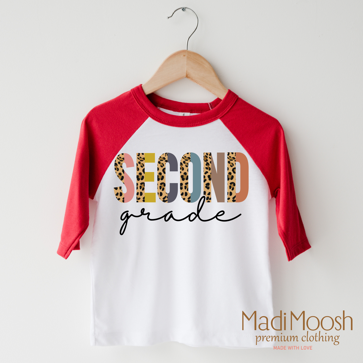 Second Grade Leopard design on a raglan shirt with red sleeves.