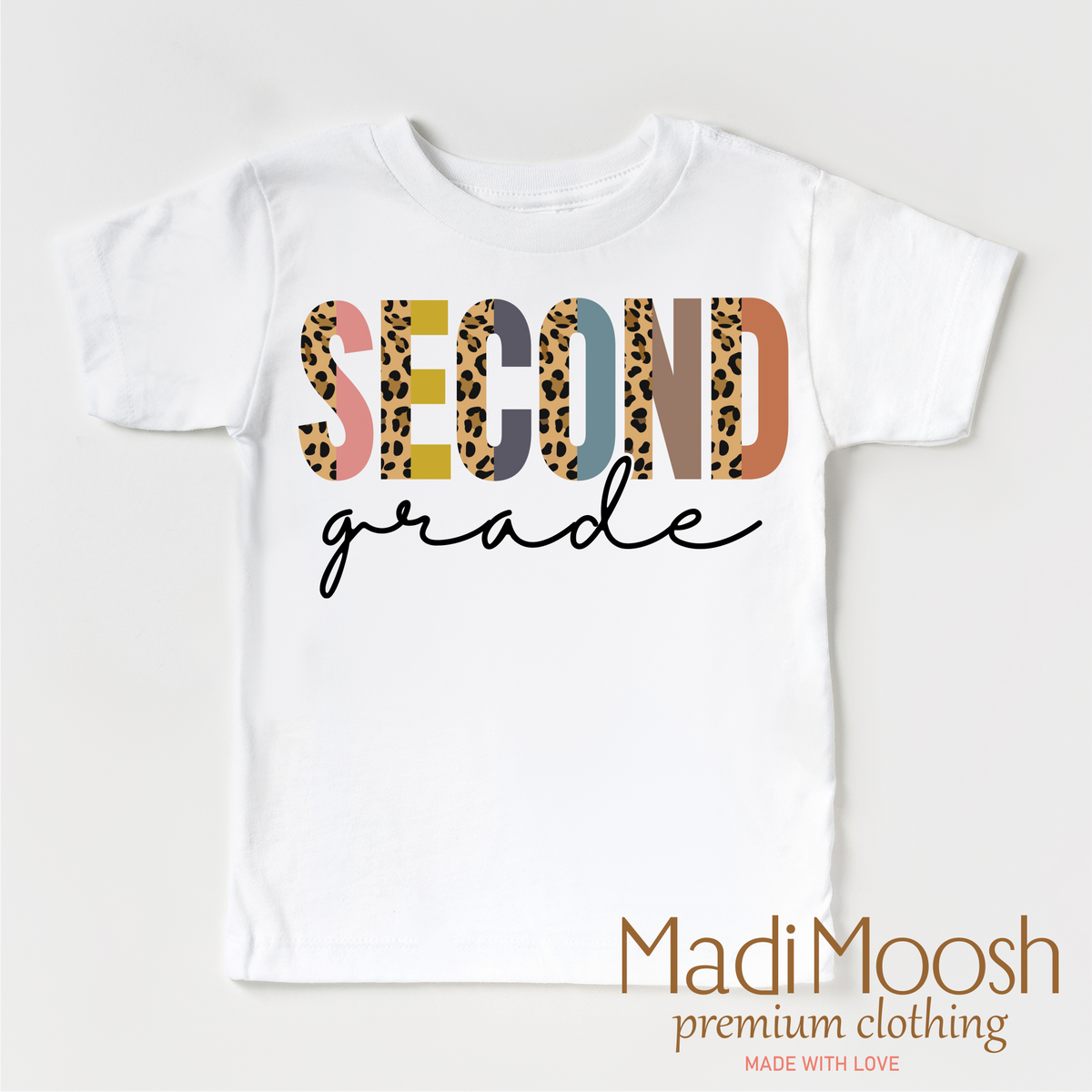 Second Grade Leopard design on a white short sleeve T-shirt.
