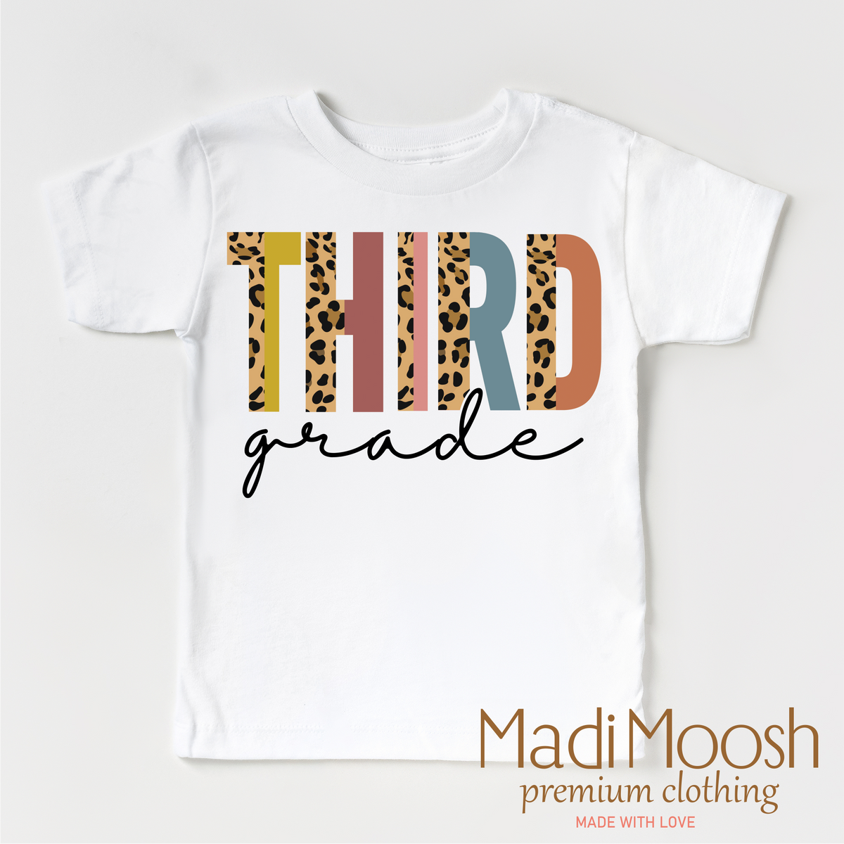 Third Grade Leopard design on a white short sleeve T-shirt.