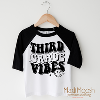 Third Grade Vibes design on a raglan shirt with black sleeves.