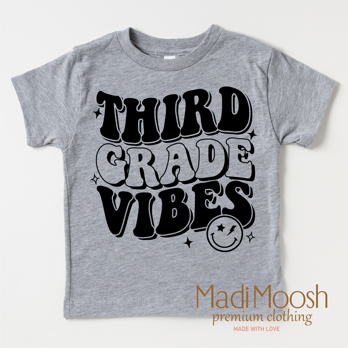 Third Grade Vibes design on a gray kids shirt.