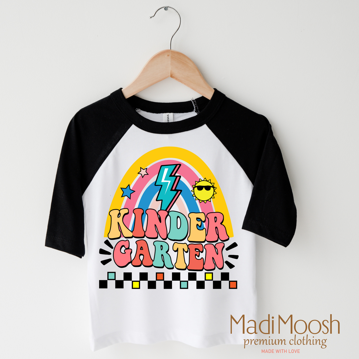 Kindergarten Rainbow School design on a raglan shirt with black sleeves.