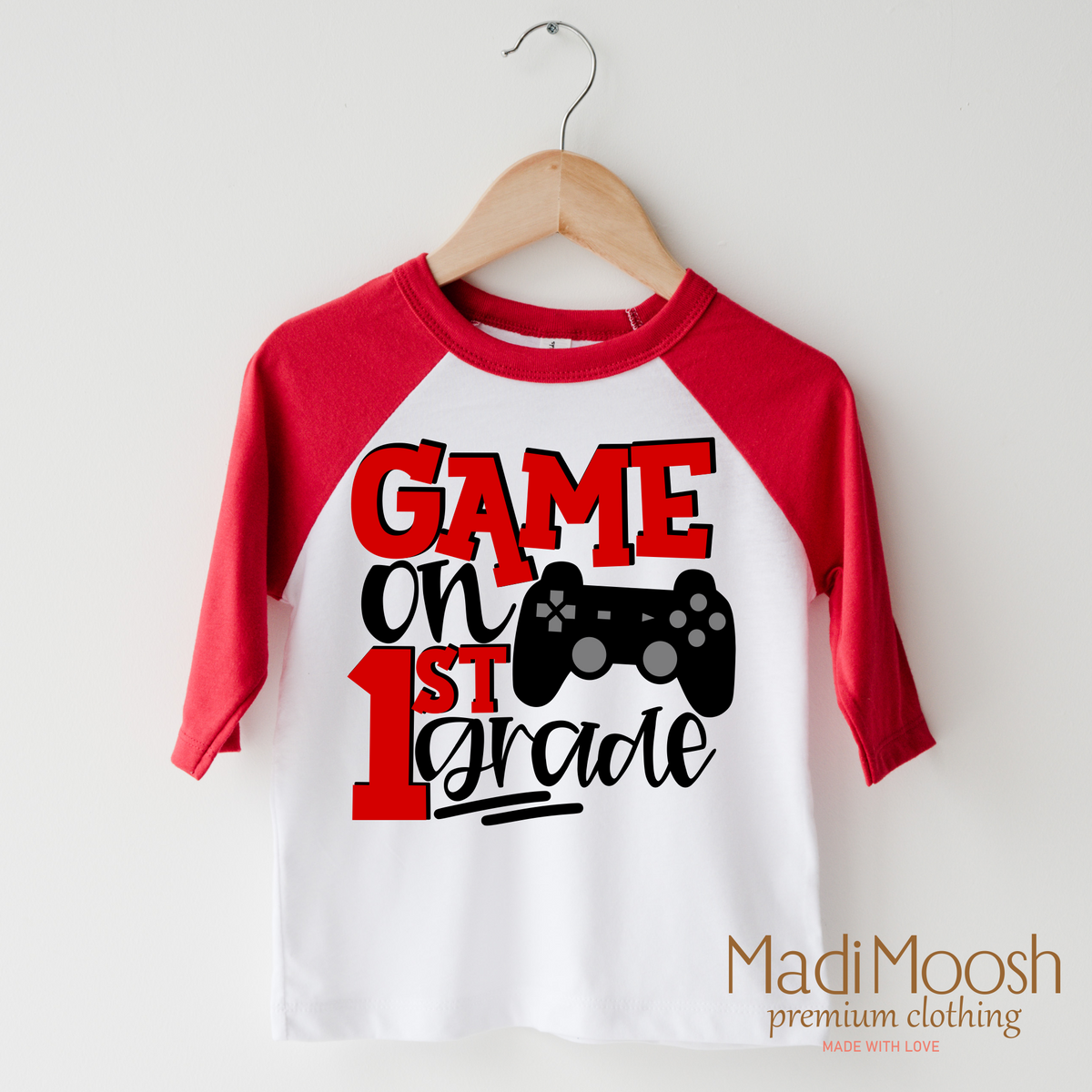 Game On First Grade Back To School design on a raglan shirt with red sleeves.