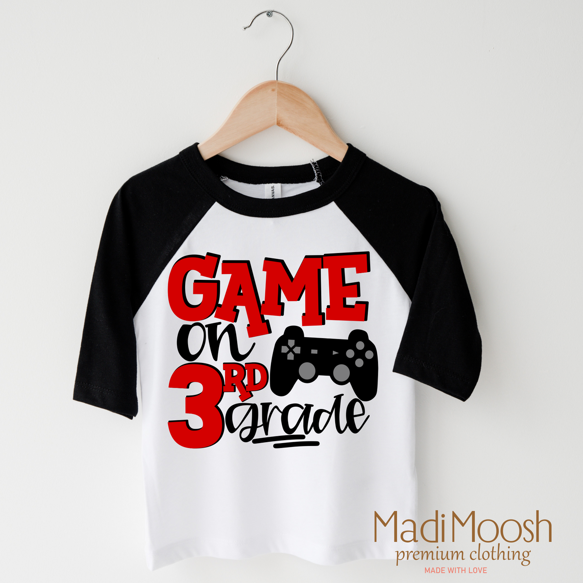 Game On Third Grade Back To School design on a raglan shirt with black sleeves.