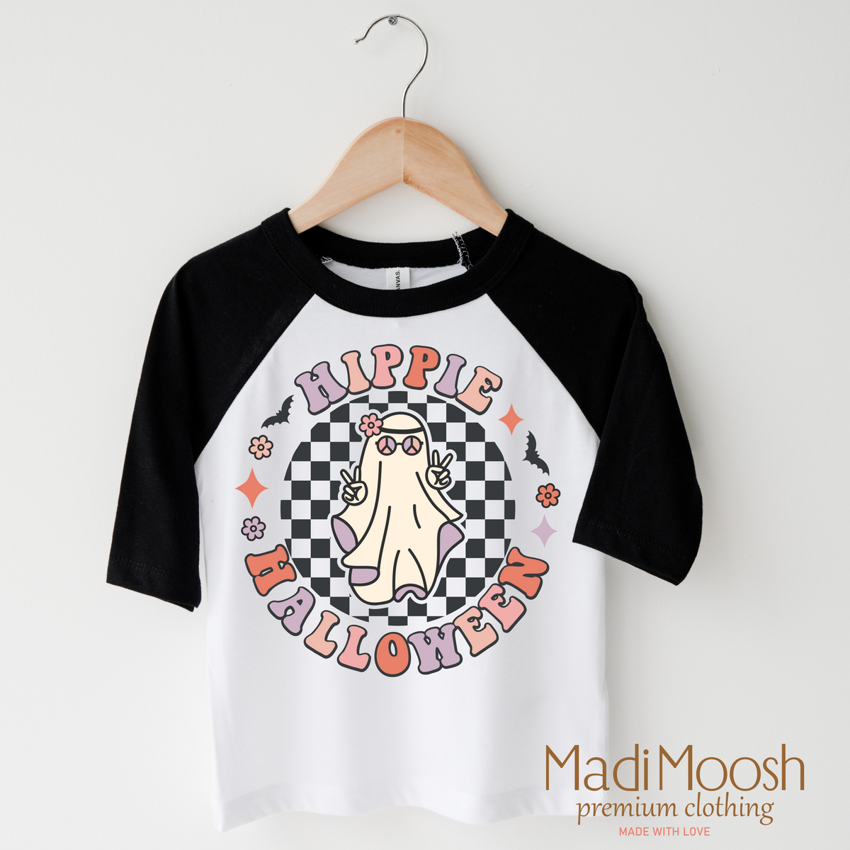 Hippie Halloween Ghost design on a raglan shirt with black sleeves.