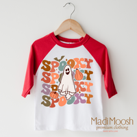 Spooky Ghost design on a raglan shirt with red sleeves.