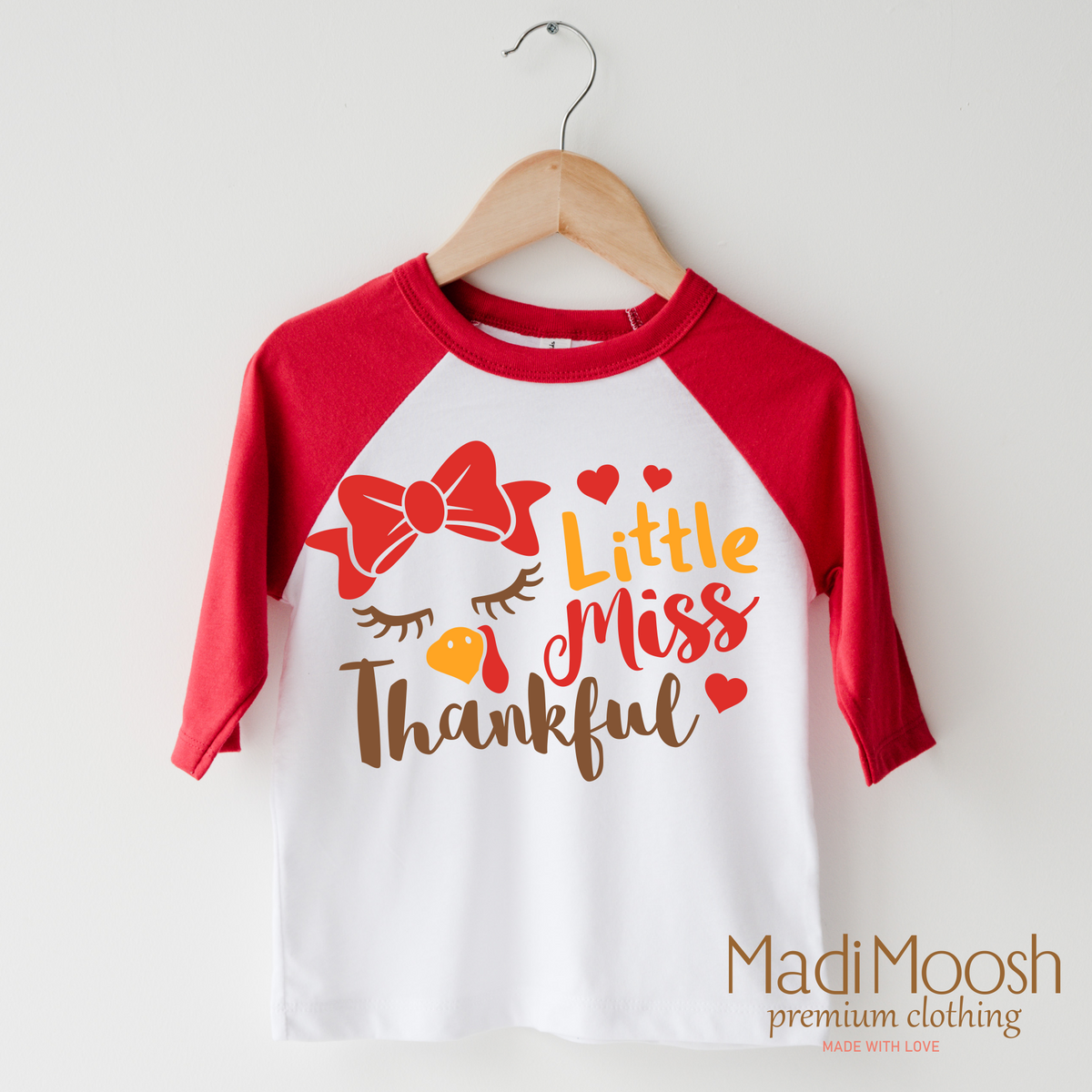 Little Miss Thankful design on a raglan shirt with red sleeves.