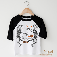 Tis The Season To Be Spooky design on a raglan shirt with black sleeves.