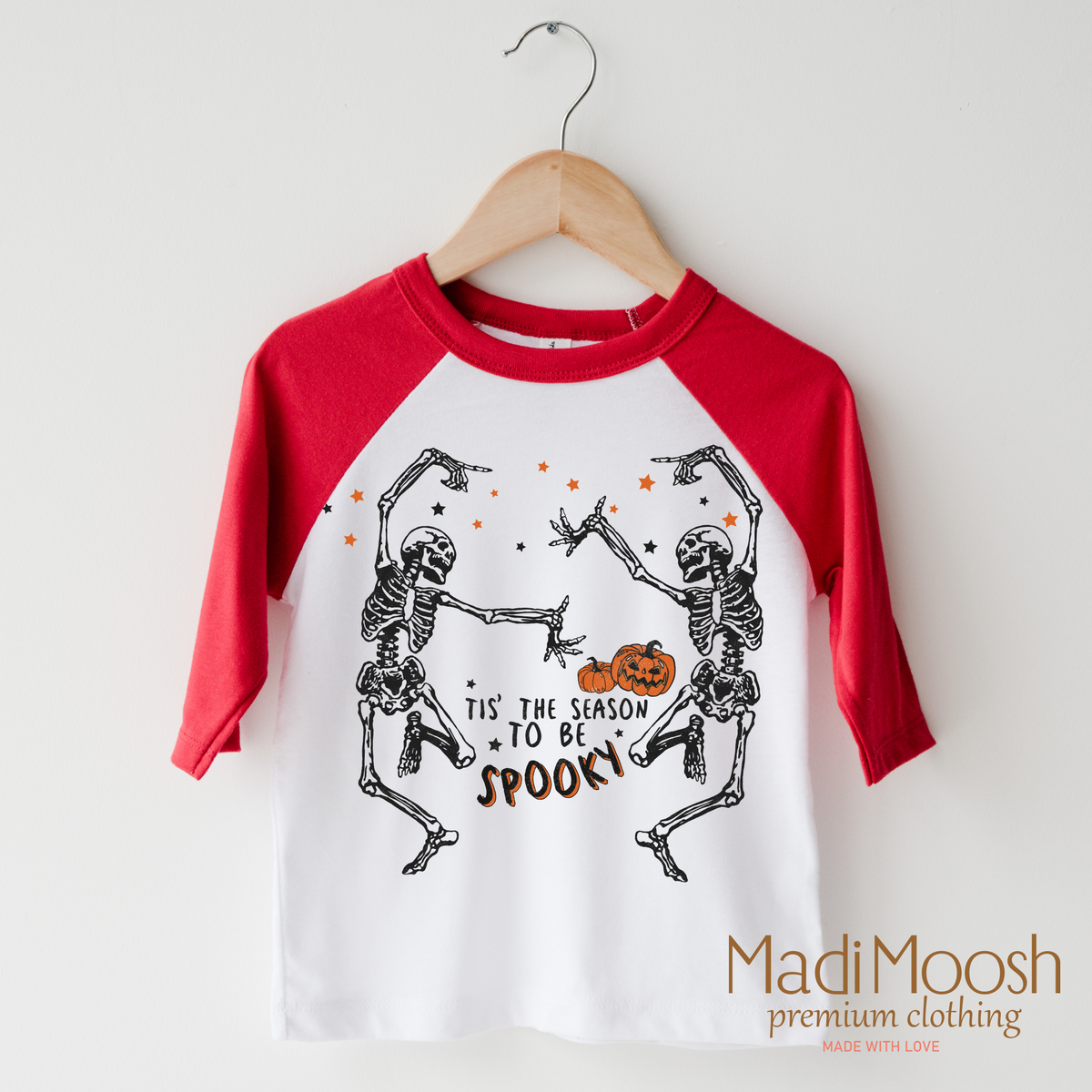 Tis The Season To Be Spooky design on a raglan shirt with red sleeves.