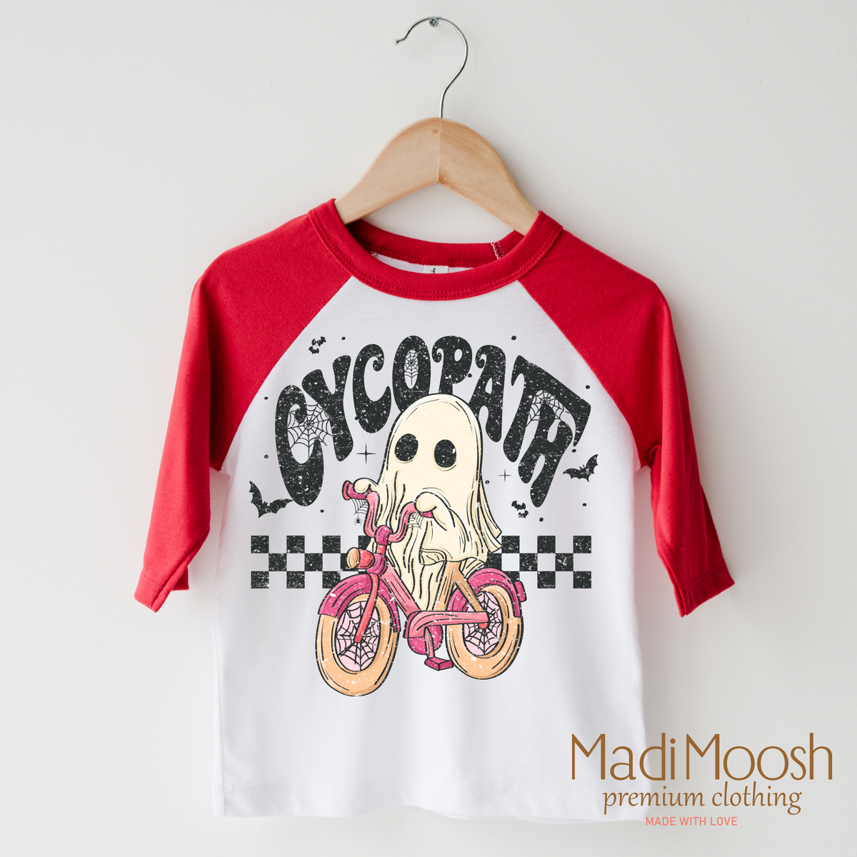 Cycopath Girls Ghost design on a raglan shirt with red sleeves.