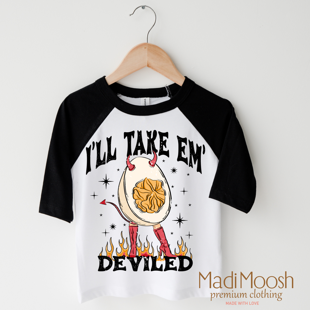 I'll Take Them Deviled Eggs design on a raglan shirt with black sleeves.