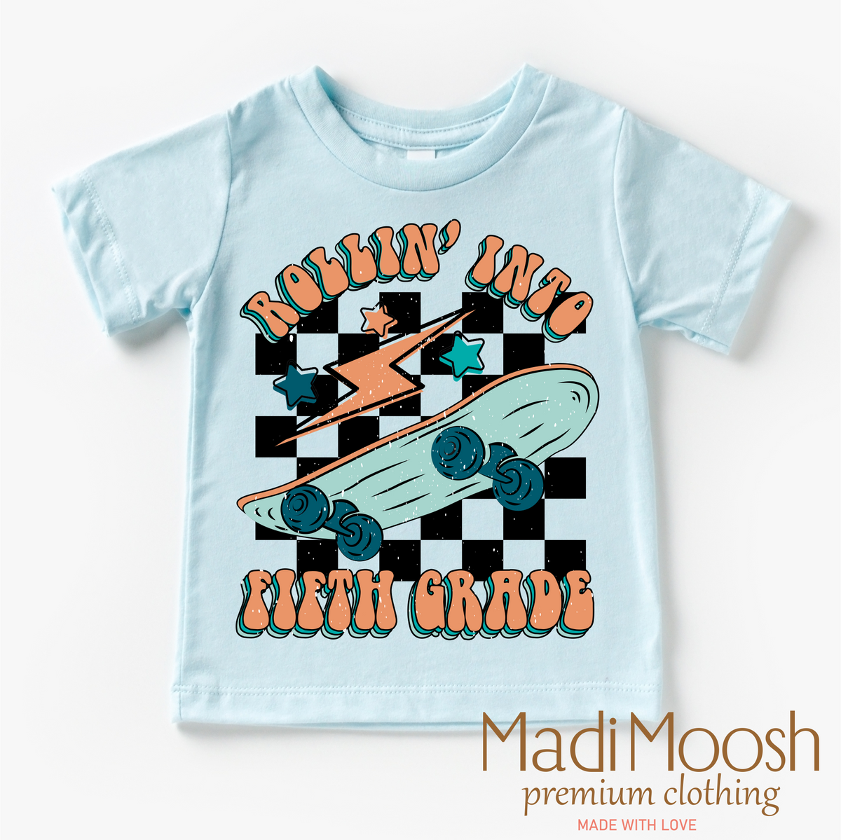 Rollin' Into 5th Back To School design on a blue garment.