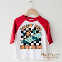 Rollin' Into 3rd Back To School design on a raglan shirt with red sleeves.