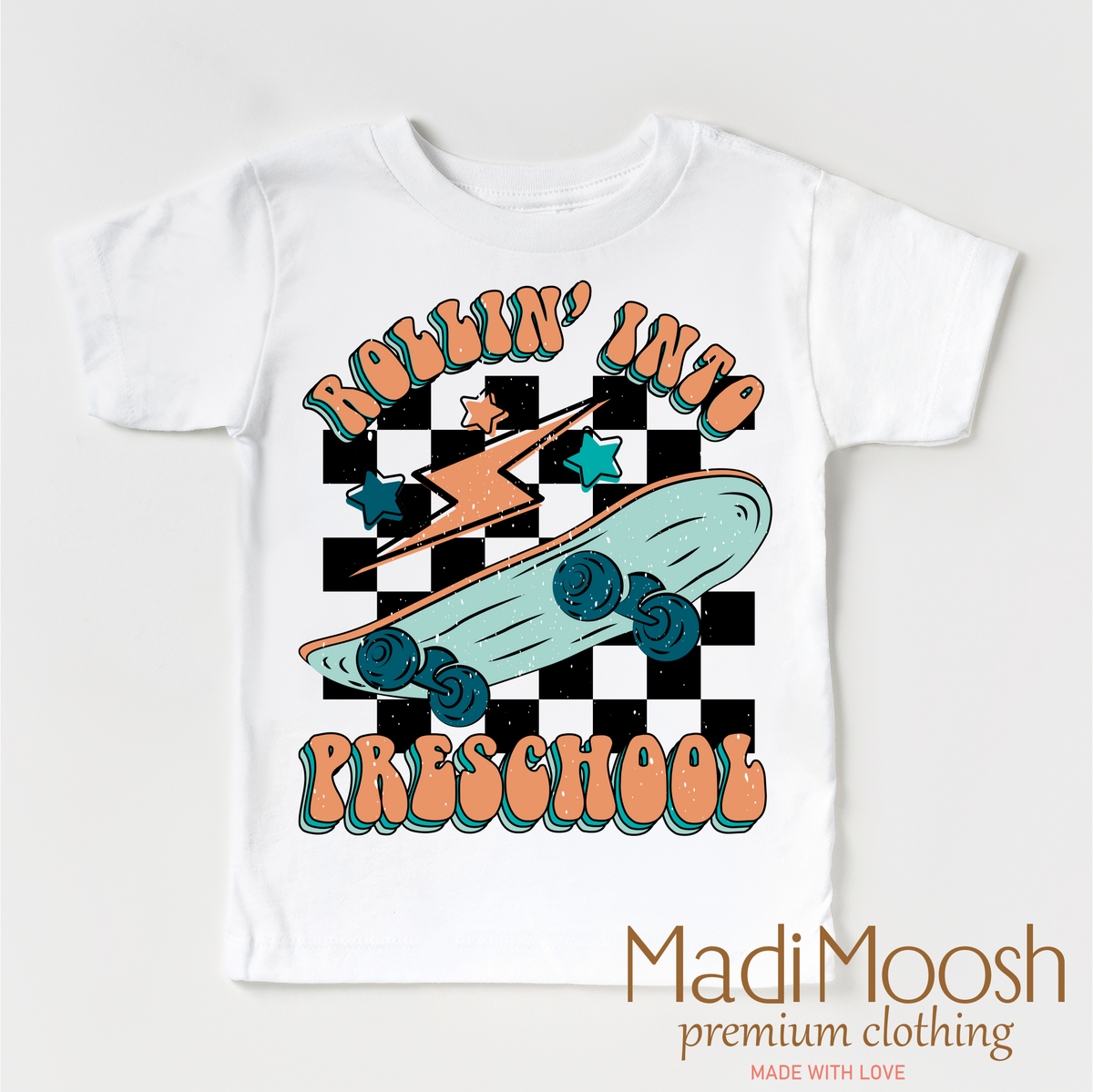 Rollin' Into Preschool Back To School design on a white garment.