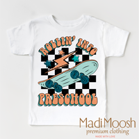 Rollin' Into Preschool Back To School design on a white garment.