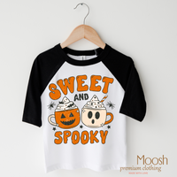 Sweet And Spooky design on a raglan shirt with black sleeves.