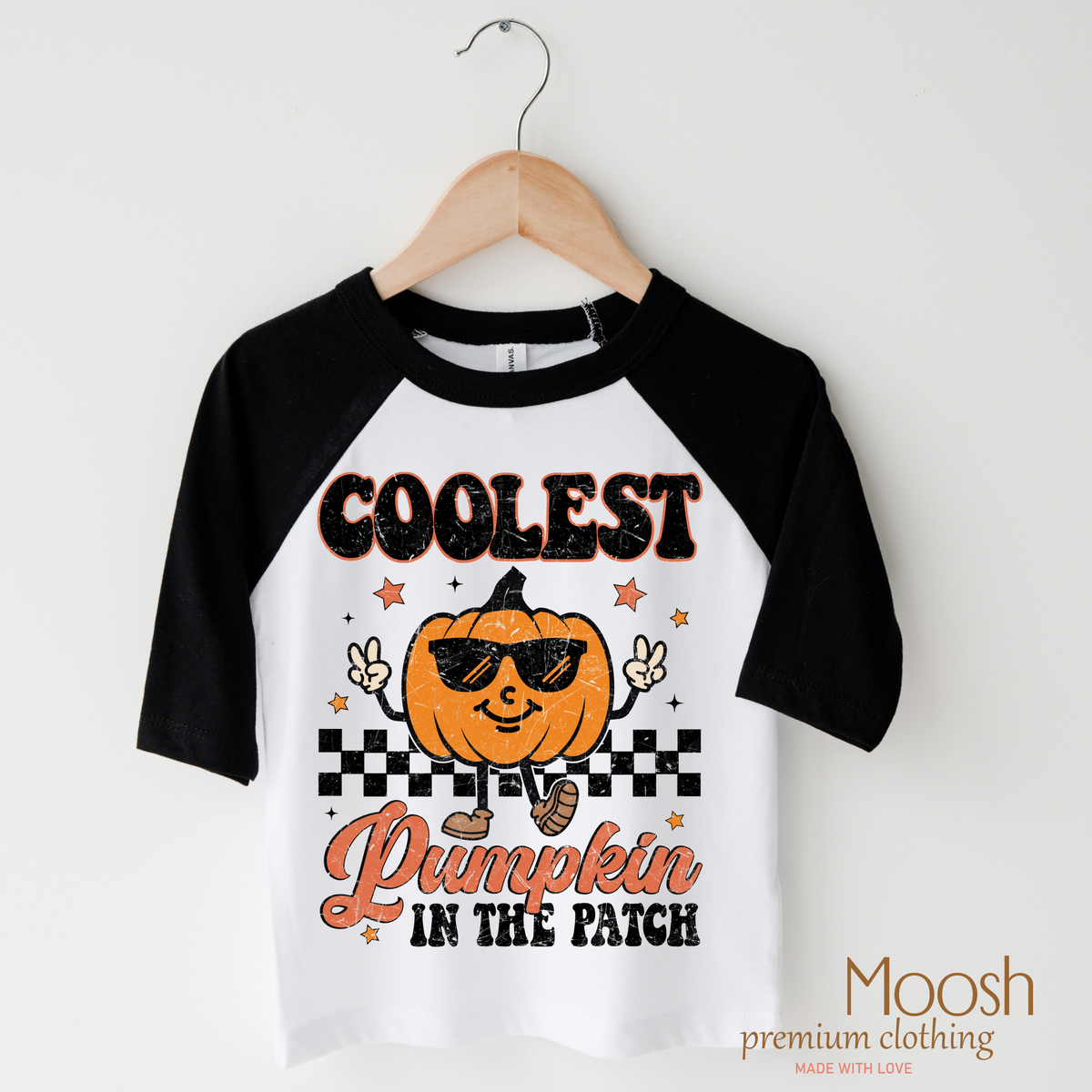 Coolest Pumpkin In The Patch Fall design on a raglan shirt with black sleeves.