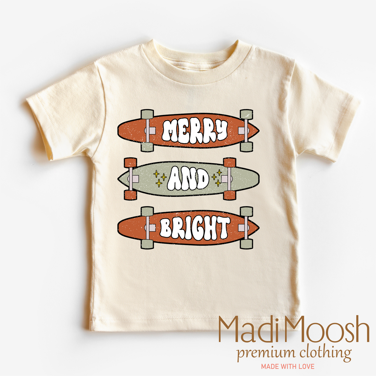 Merry And Bright Skater Christmas design on a natural kids T-shirt.
