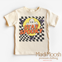 Stay Spooky Ghost design on a natural kids T-shirt.