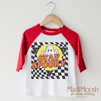Stay Spooky Ghost design on a raglan shirt with red sleeves.