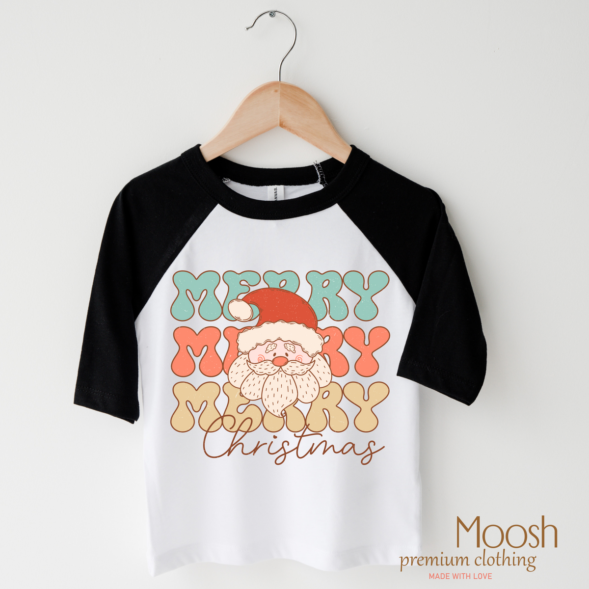 Merry Christmas Santa design on a raglan shirt with black sleeves.
