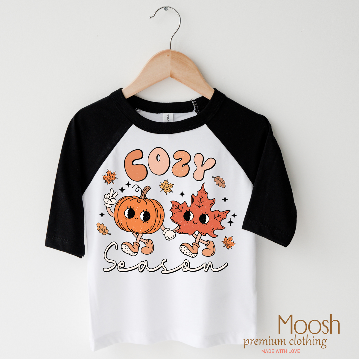 Cozy Season Fall design on a raglan shirt with black sleeves.