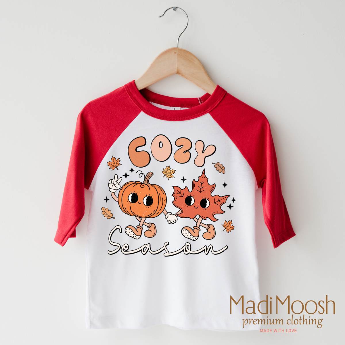 Cozy Season Fall design on a raglan shirt with red sleeves.