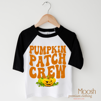 Pumpkin Patch Crew design on a raglan shirt with black sleeves.