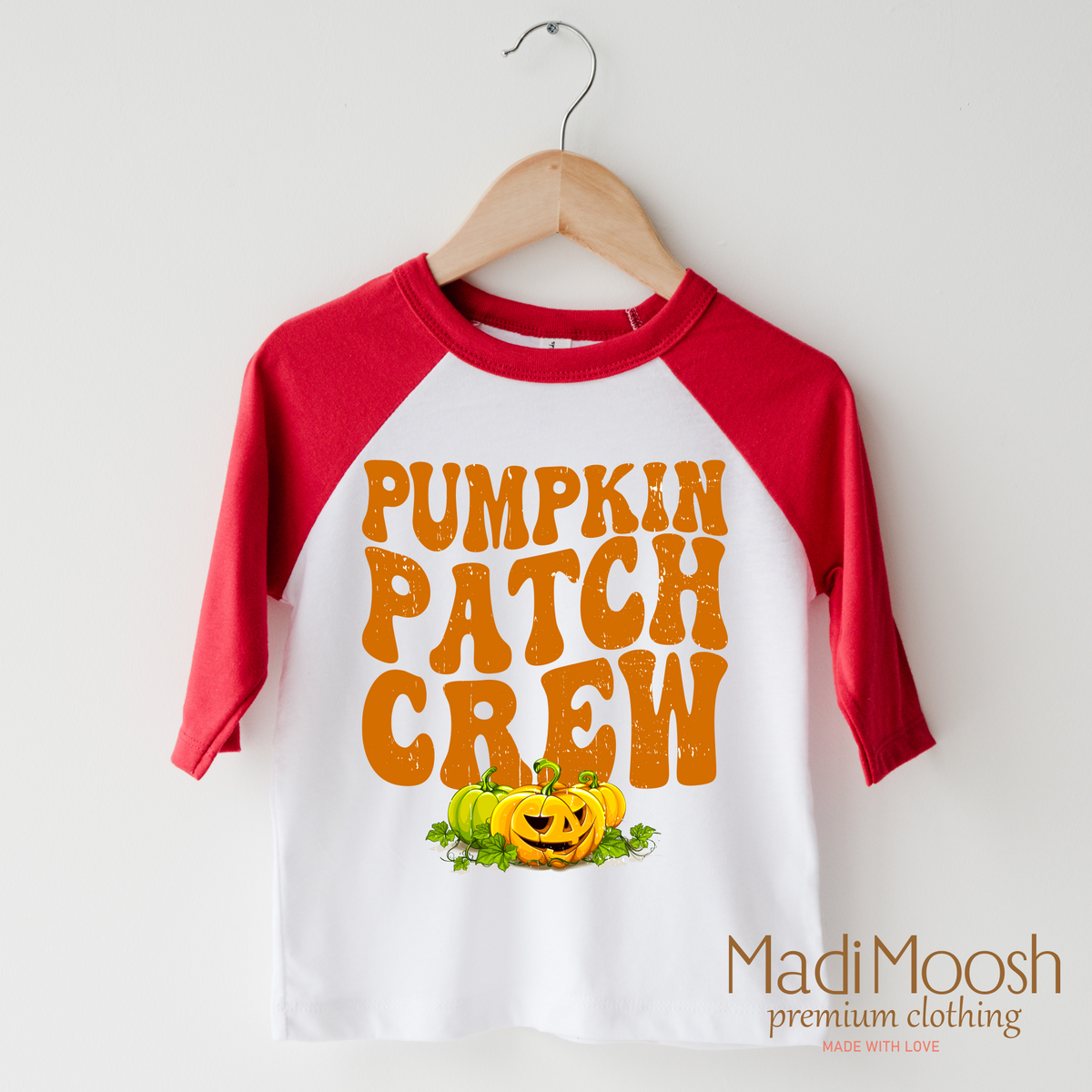 Pumpkin Patch Crew design on a raglan shirt with red sleeves.