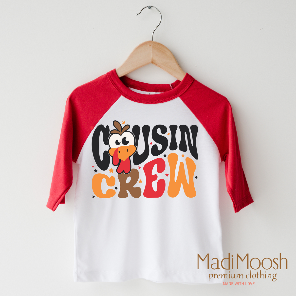 Cousin Crew design on a raglan shirt with red sleeves.