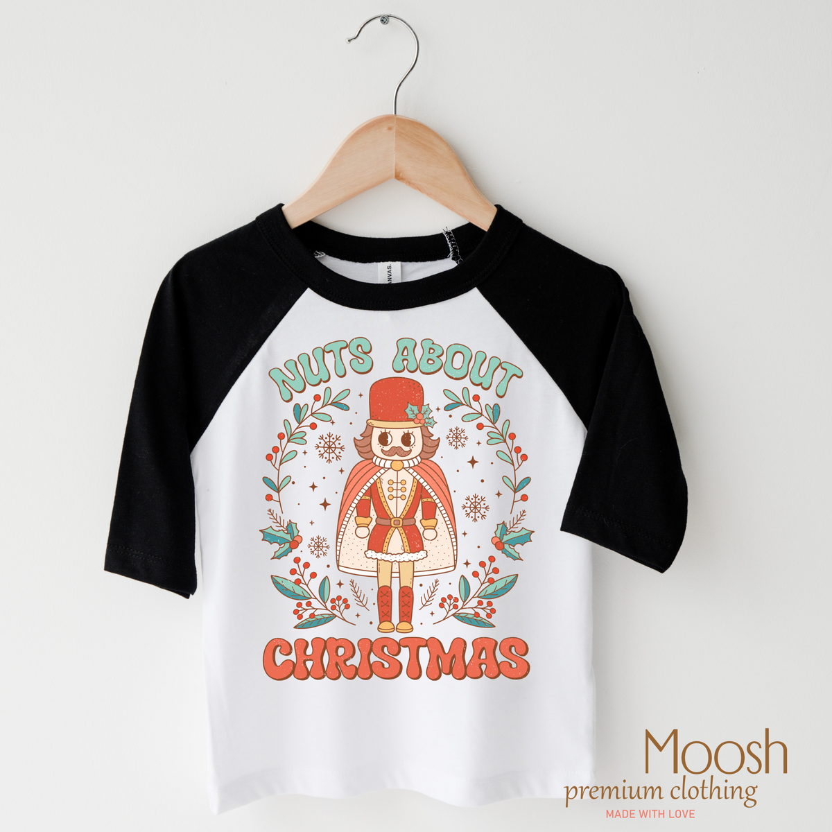 Nuts About Christmas design on a raglan shirt with black sleeves.