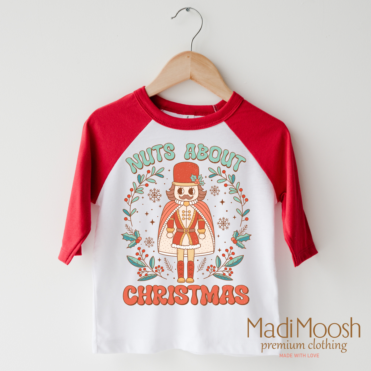 Nuts About Christmas design on a raglan shirt with red sleeves.