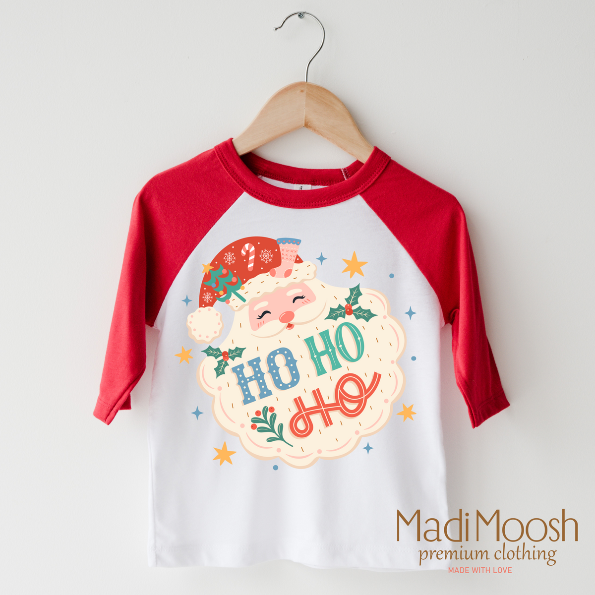 Ho Ho Ho Santa design on a raglan shirt with red sleeves.