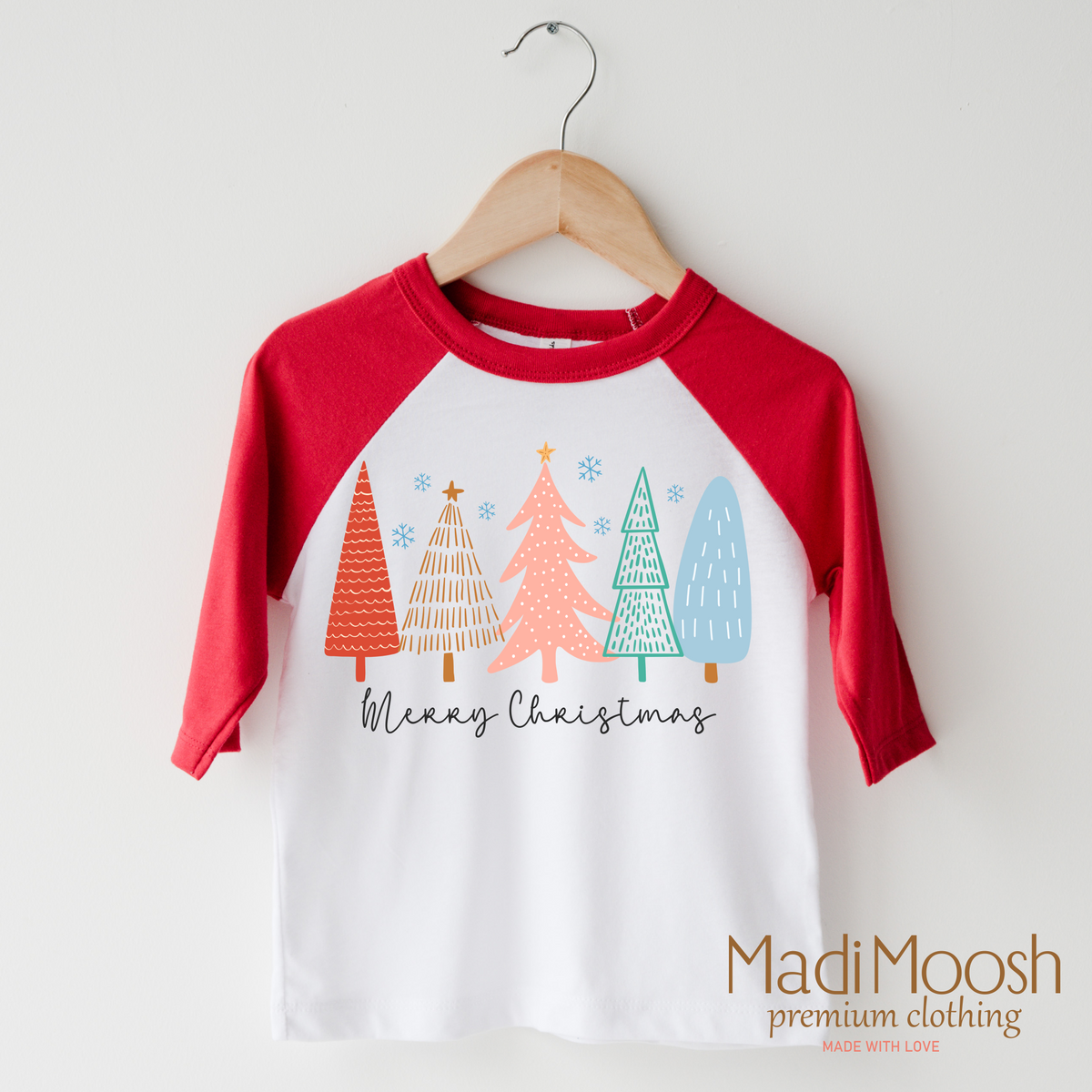 Merry Christmas Trees design on a raglan shirt with red sleeves.