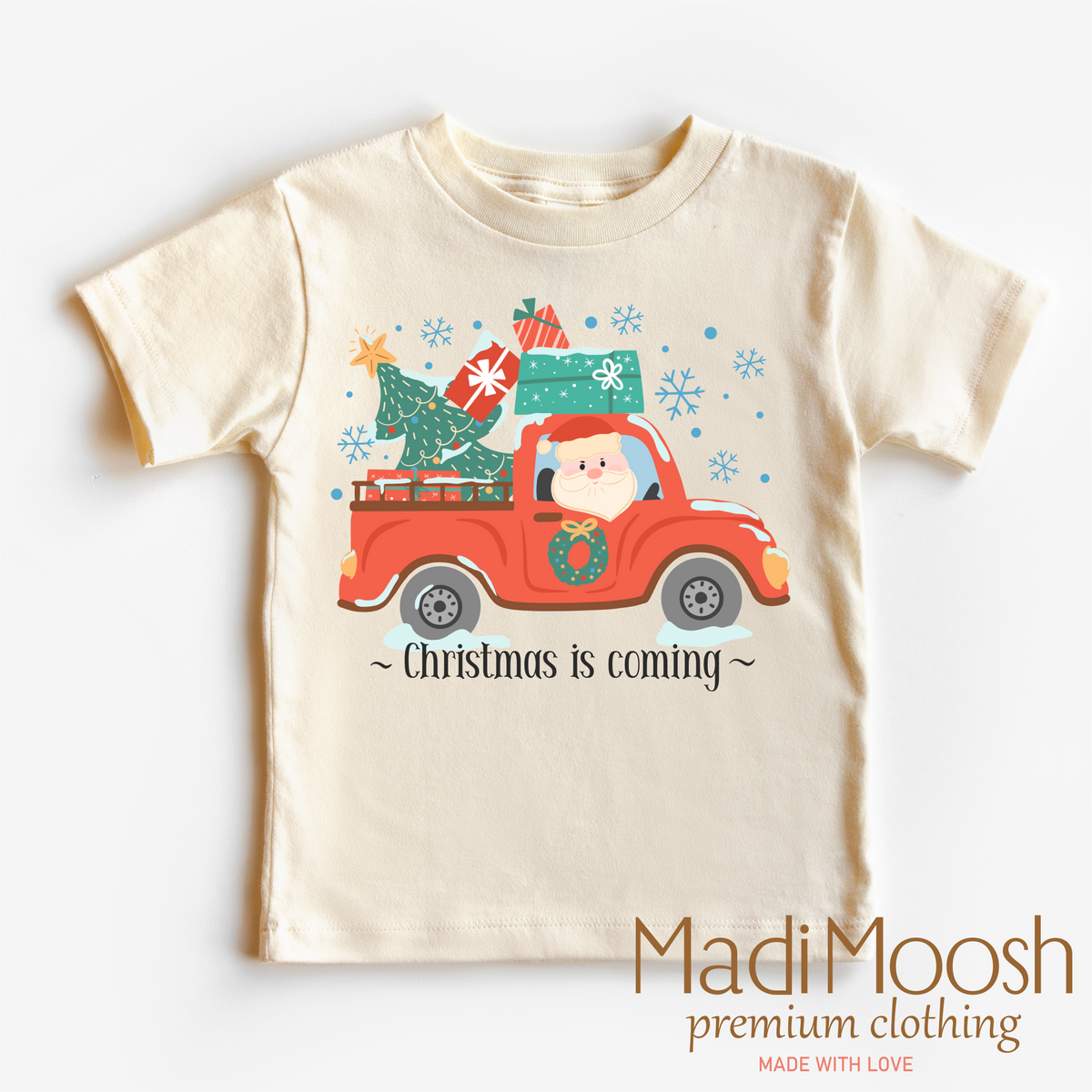Christmas Is Coming graphic T-shirt by Madi Moosh