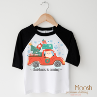 Christmas Is Coming design on a raglan shirt with black sleeves.