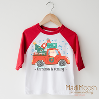 Christmas Is Coming design on a raglan shirt with red sleeves.