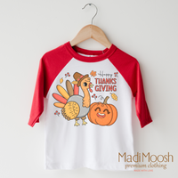 Happy Thanksgiving design on a raglan shirt with red sleeves.