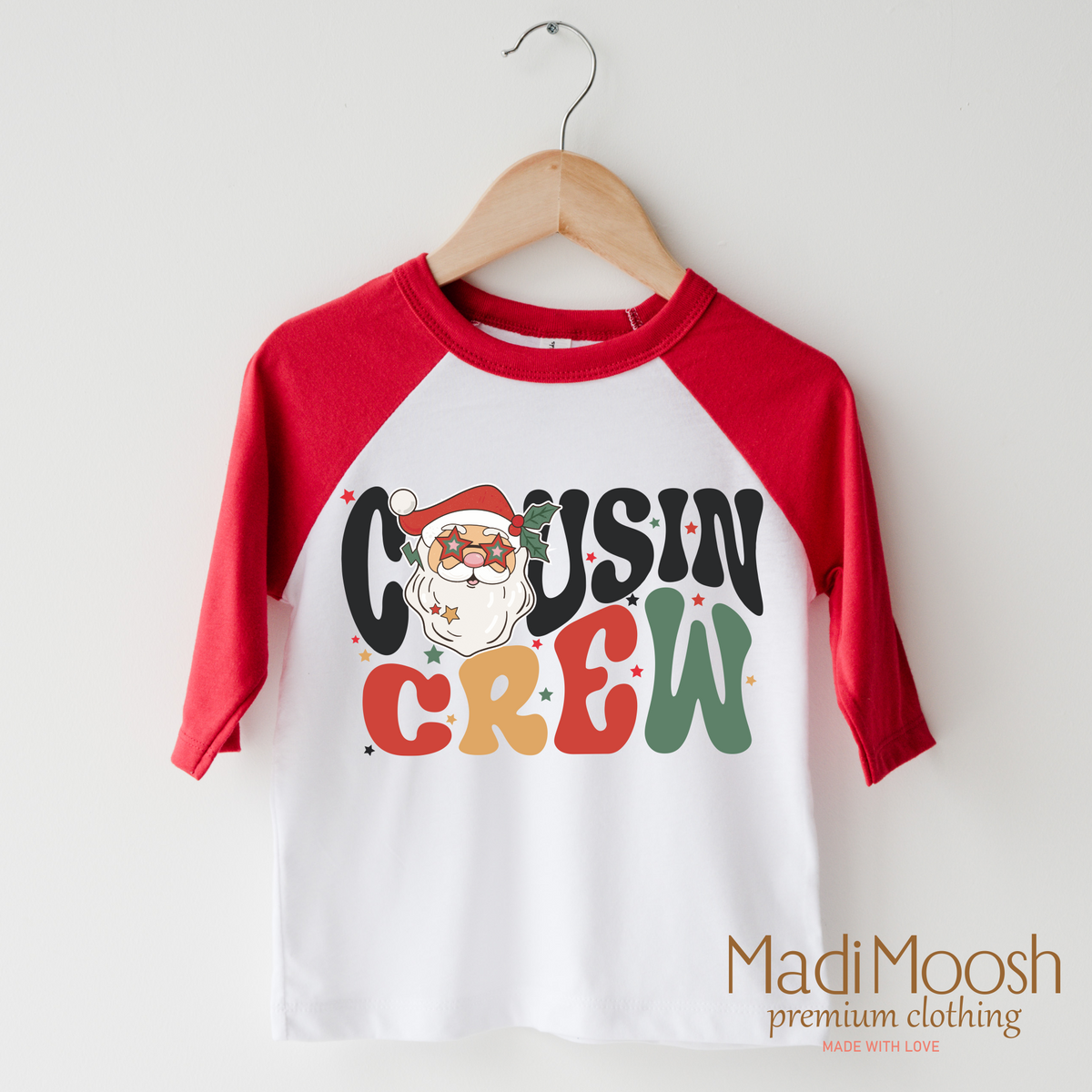 Christmas Cousin Crew design on a raglan shirt with red sleeves.