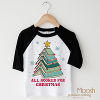 All Booked for Christmas design on a black-accented shirt.