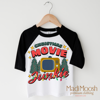Christmas Movie Junkie design on a black-accented shirt.
