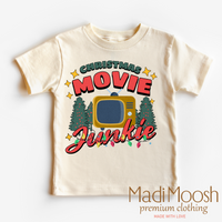 Christmas Movie Junkie graphic T-shirt by Madi Moosh