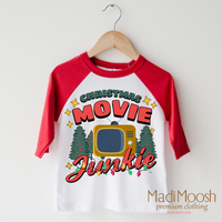 Christmas Movie Junkie design on a red-accented shirt.