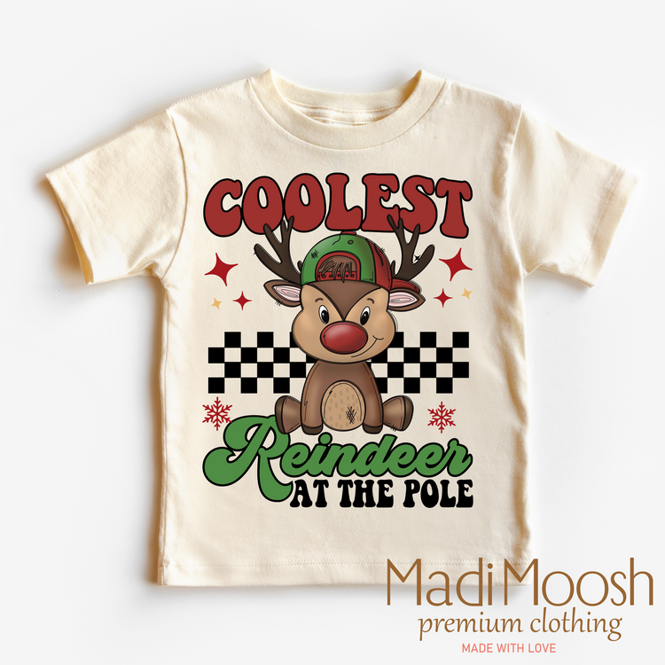 Coolest Reindeer At The Pole, Christmas graphic T-shirt by Madi Moosh