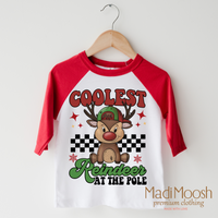 Coolest Reindeer at the Pole design on a red-accented shirt.
