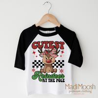 Cutest Reindeer at the Pole design on a black-accented shirt.