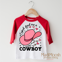 Cupid Find Me A Cowboy Valentine's design on a red-accented shirt.