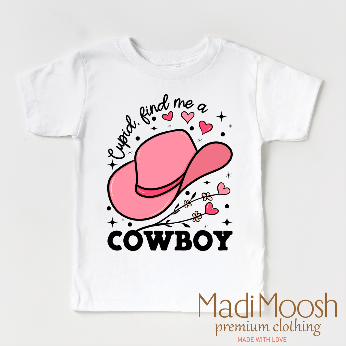 Cupid Find Me A Cowboy Valentine's design on a white garment.