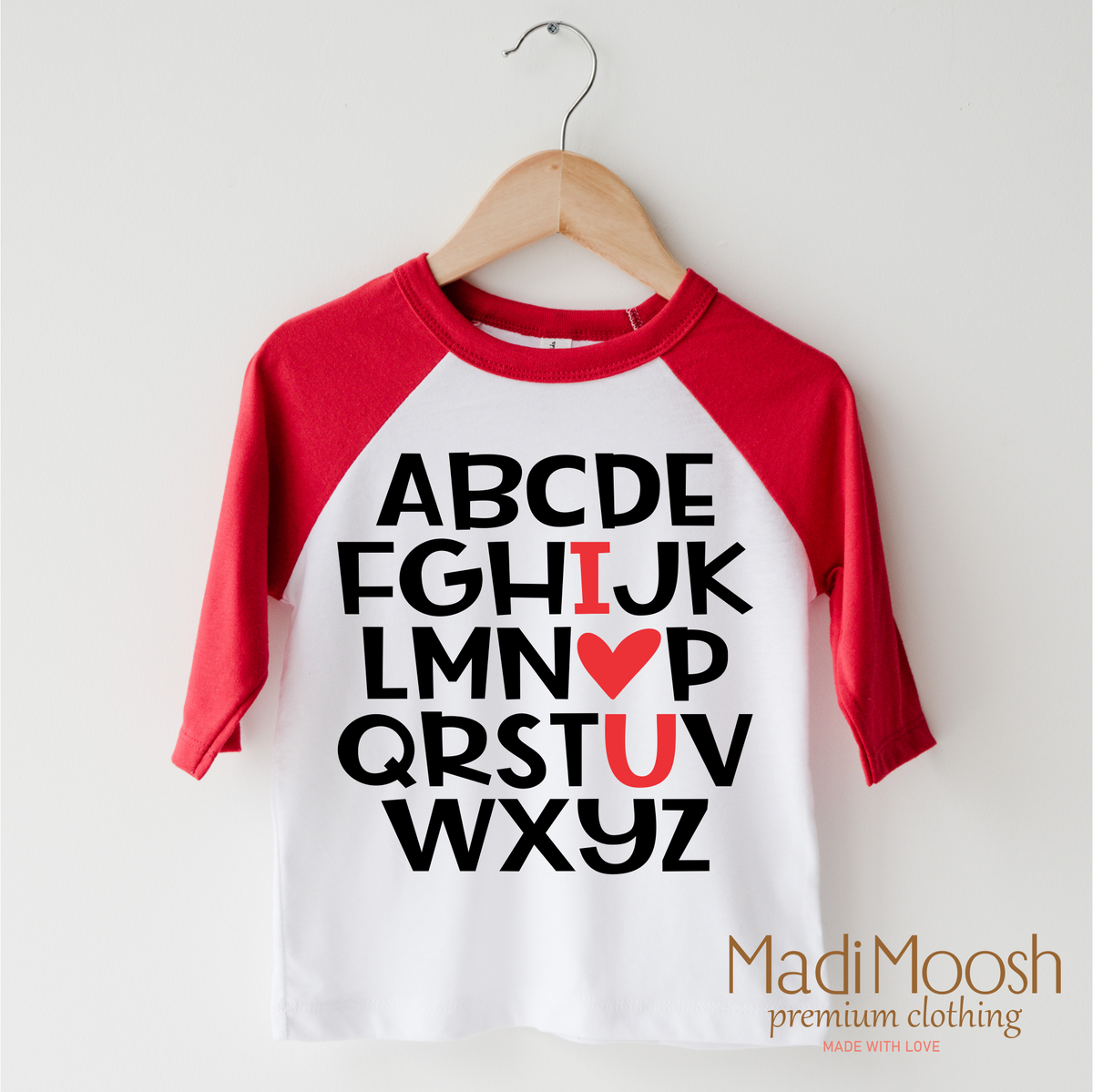 ABC I Love You Valentine's Day design on a red-accented shirt.